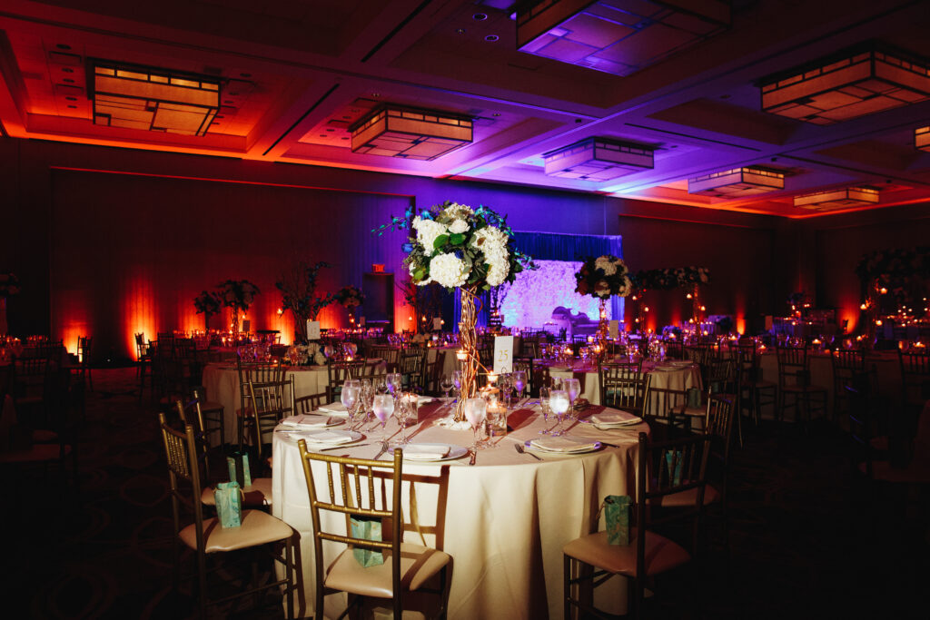 decorated banquet hall with served round table with hydrangea ce